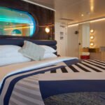 The Peek-A-Boo shower window over the Euro King bed is a feature in our Gorgeous and Brilliant suites. Here you can also see the Glam Area.